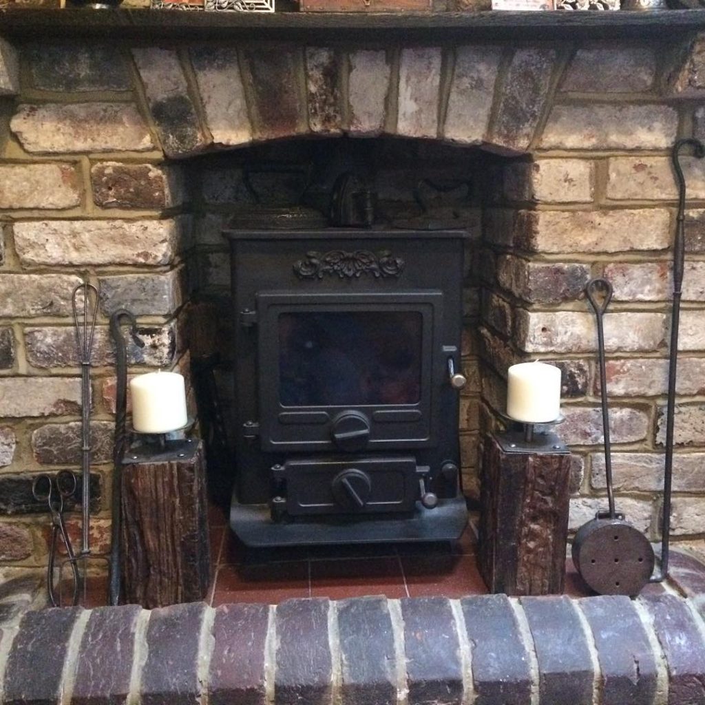 Multi fuel stove in a brick fireplace